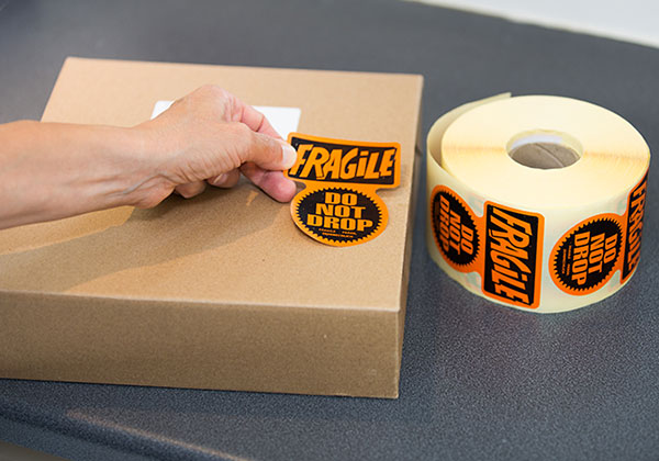 Self adhesive labels on a roll